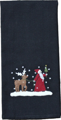 Our Christmas Friends Towel features detailled applique and embroidery of Father Christmas and his reindeer friend walking through a winter wonderland on a black ground.