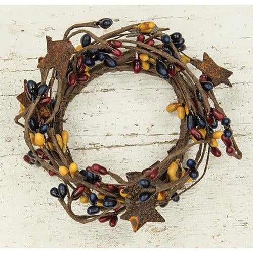 Pip Berry Ring with Stars, features six small rusty tin stars and navy, burgundy and mustard berries. Visit website for free shipping & discount offers.