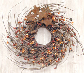 Primitive Mix Pip & Star Twig Wreath has rusty star accents with Primitive Mix pips, which is a blend of black, rusty and orange berries. It is 10" in diameter.