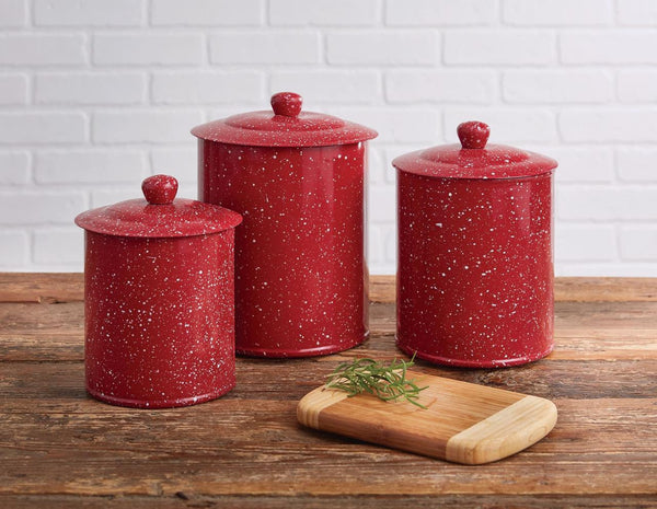 The Granite Enamelware Red Canister Set will add a bold pop of color to your countertop or shelf! Combine with the dinner plates, salad plates, mugs, and bowls for a complete setting! So beautiful!  Colors: Candlelight White & Patriotic Red