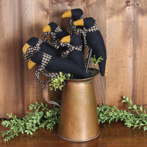 Our Crow on Stick Black (set of 6) is made of cotton. this is a 3 - 12 in h x 4.5 in w; 3-10 in h x 4.5 in w ornament set that will add the finishing touches to any room.