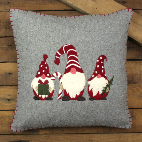 Holiday Gnomes Gray Pillow made of Wool Felt.  Features three gnomes holding a present, candy cane and a Christmas Tree.