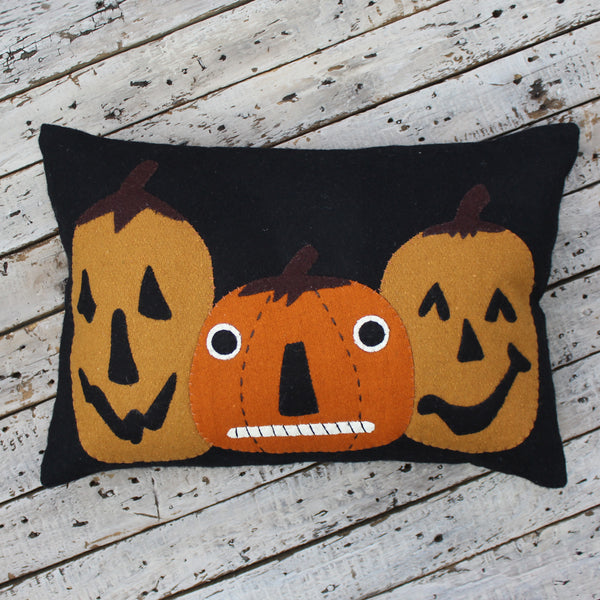 Jack-o-lanterns Felt Black Pillow is made of wool feltand features three pumpkin friends. Measures 14" x 20 Made of Wool Felt Fall Decor
