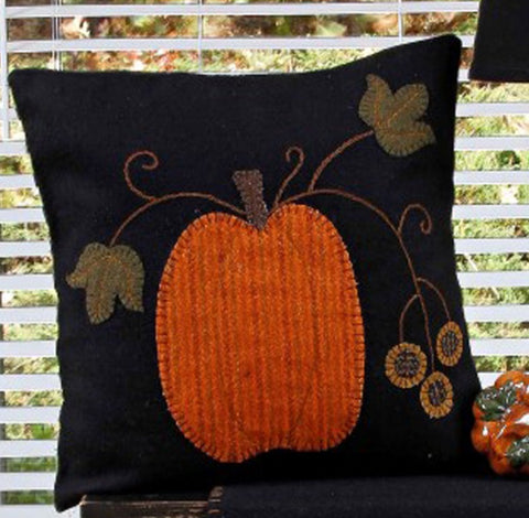 Pumpkin Pillow features a pumpkin applique with vine details.
