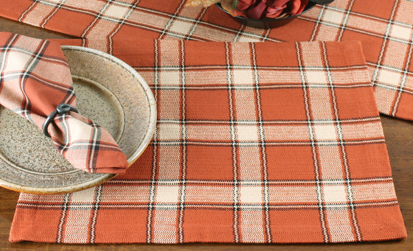 Harvest Moon Placemat (set of 6) features a plaid of pupkin spice, black and cream in an evocative texture. Finish the look with these coordinating items!