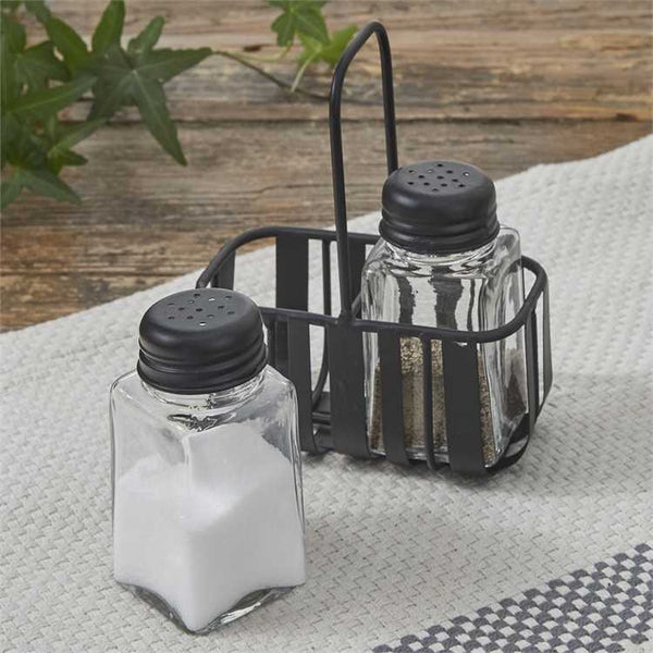Keep seasonings stylishly on hand with the Spencer Salt & Pepper Caddy Set. Sturdy black caddy with glass jars adds rustic farmhouse charm to your kitchen.