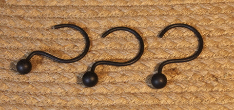 Complete your farmhouse bathroom with our set of 12 black iron shower curtain hooks. Durable, simple, and primitive style for a rustic finishing touch.