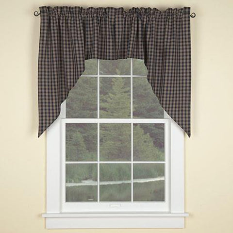 The Sturbridge Swags in a charming navy & tan plaid provide a delightful dressing for your windows! Simple, yet striking, they come unlined to allow soft filtered light to shine through! Pretty on their own, or pair with coordinating tiers for a more striking appeal! 