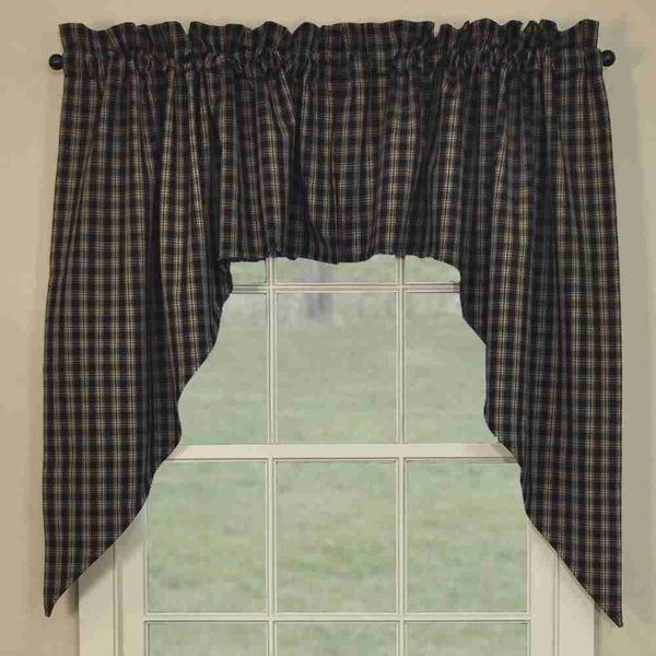 Sturbridge Black SwagThe Sturbridge Swags in a charming traditional black & tan homespun plaid provide a delightful dressing for your windows! Simple, yet striking, they come unlined to allow soft filtered light to shine through! Pretty on their own, or pair with coordinating tiers for a more striking appeal!  Colors: Black & Farmhouse Tan