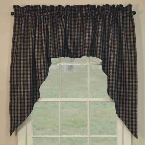 Sturbridge Black SwagThe Sturbridge Swags in a charming traditional black & tan homespun plaid provide a delightful dressing for your windows! Simple, yet striking, they come unlined to allow soft filtered light to shine through! Pretty on their own, or pair with coordinating tiers for a more striking appeal!  Colors: Black & Farmhouse Tan