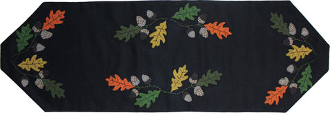 Fall Leaves & Acorns Table Runner 45"features beautiful appique detail of multi colored leaves and acorns on black a black background.