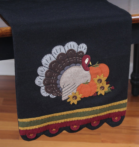 Turkey Time Wool Felt Table Runner featuresa  classic applique design on wool felt that creates an adorable home accent to celebrate the day of thanks