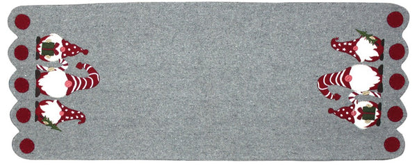Holiday Gnomes Gray Table Runner features 3 Gnomes at either end holding a present, candy cane and a Christms Tree.