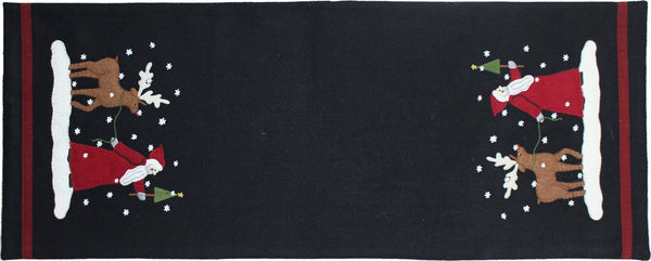 Christmas Friends Wool Felt Table Runner features a delightful design of Father Christmas and his reindeer friend walking through a winter wonderland embroidered and appliqued on a black ground.