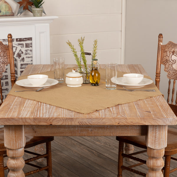 Add rustic farmhouse charm with the Burlap Natural 40x40 Table Topper. Neutral dark tan burlap with frayed edges brings timeless country style to any table.
