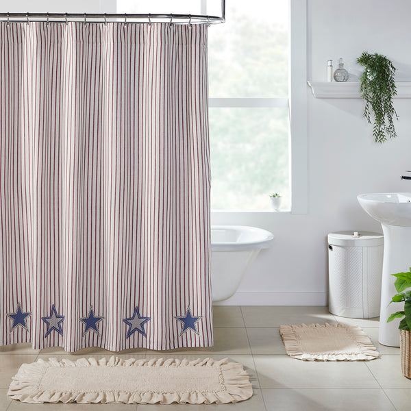 Celebration Shower Curtain (72x72) with ticking stripe fabric and applique stars in crème, blue, and red. Cotton-linen farmhouse shower curtain with buttonholes for easy hanging.