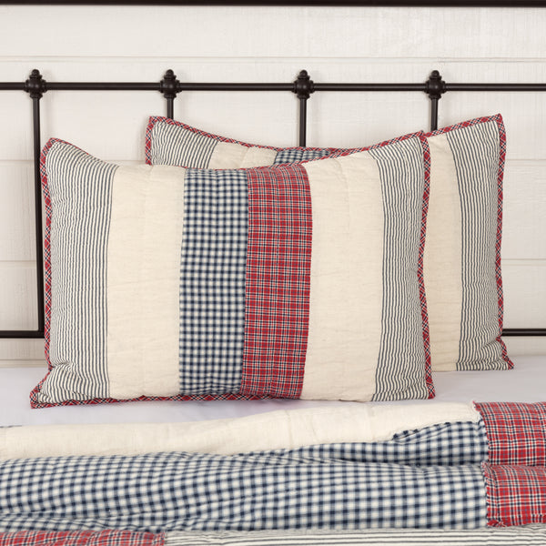Hatteras Patch Standard Sham 21x27, Seersucker fabric in classic patchwork are united in American red, cotton white, and denim blue - all pieced together in a mix of square and rectangular patchwork. Primitive Country Farmhouse Bedding Home Decor.