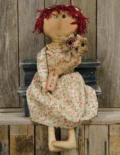Millie Doll wears a floral dress and carries several stuffed flowers made of plaid and floral material. She has red yarn hair, an antique name tag, and measures 23½" high. Primitive Country Farmhouse Vintage Home Decor Accessories.