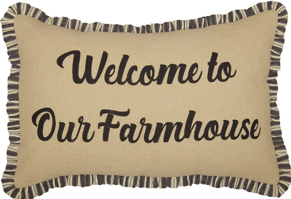 Ashmont Burlap Vintage Welcome to Our Farmhouse Pillow 14x22, features "Welcome to our Farmhouse" across the front on a natural burlap background.  Finished with a ruffled charcoal grey and creme stripe trim for added detail and a vintage flair. Primitive Country Farmhouse Bedding Home Decor.