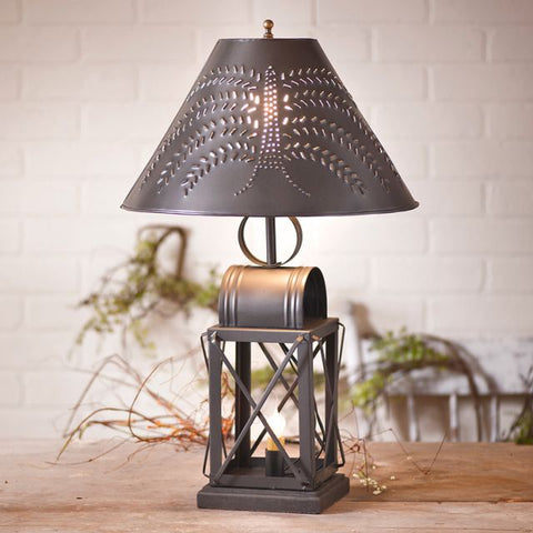 A beautiful open bottom lamp with a traditional folk art willow tree shade.  Smokey Black finish. E26/Medium (Standard) socket in top, 150 watts max. E12/Candelabra socket in bottom, 60 watts max. Has a three-way switch and a 7-foot cord. Includes a 15 Inch shade with a punched willow tree design. Has an 8 Inch harp with finial. Metal construction with a wood base. Primitive decor Farmhouse Punched tin