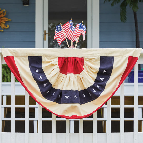 Star Spangled Bunting! Featuring red, white and blue strips on a large half circle of fabric! The blue stripe is decorated with white stars. This is a lovely tribute to our country that can be used not just on July 4th, but all year long!  Dimensions: 27" x 46"
