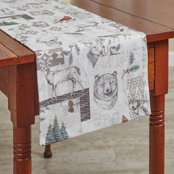 Add a classic and whimsical touch to your holiday table with the Wild and Beautiful Holiday Table Runner! Featuring a traditional Black and white woodland animals pattern with green and red accents. These table runners are sure to be a charming winter addition to your kitchen! Available in two sizes (sold separately).