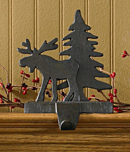 And the stockings were hung by the chimney with care...Sporting an iron finish, this moose ambling by a tree in the forest will be happy to hold your favorite Christmas stocking! So versatile...use on a mantel, table, or any ledge in your home! Moose & Tree Stocking Hangers make decorating for the season fun & easy!