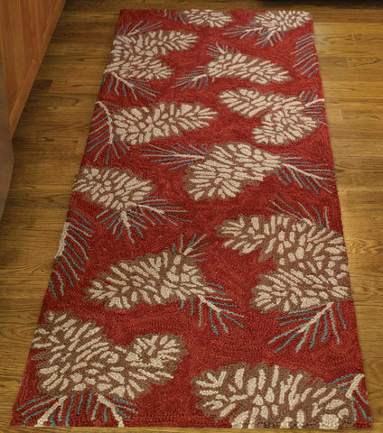 Bring the outdoors into your home with the lively Pinecone Hooked Rug Runner! The rich red base provides a pop of color with the classic pinecone design! Available in 2 sizes!