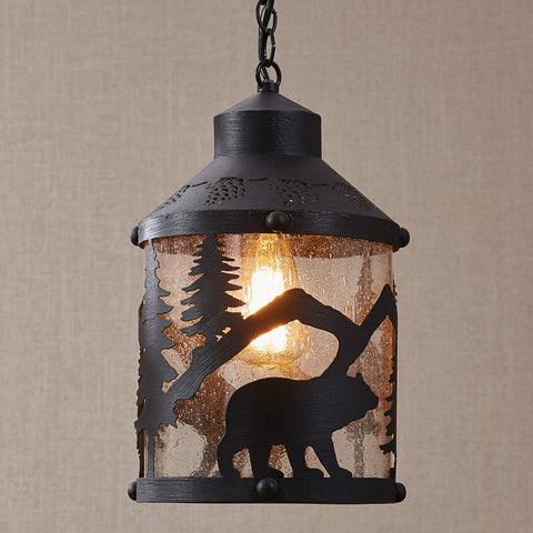 Black bear pendant features laser cut scene over bubble glass. Punched Pinecone detail around top of pendant. Black finish.3 foot adjustable chain,7 feet of cording and coordinating ceiling plate included. 60 Watt.