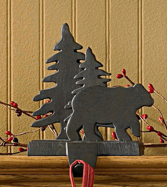 And the stockings were hung by the chimney with care...Sporting an iron finish, this bear ambling through the trees will be happy to hold your favorite Christmas stocking! So versatile...use on a mantel, table, or any ledge in your home! Be sure to check out our large selection of stocking hangers that make decorating for the season fun & easy!