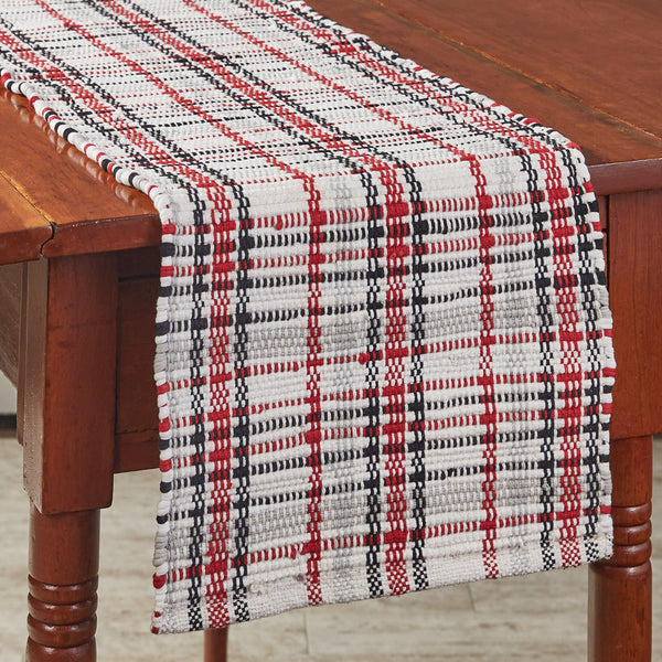 Add a touch of texture and holiday color throughout your home with these striking Farmhouse Festive Chindi Table Runners, featuring a plaid of black, red, gray, and candlelight white! The runners are available in two different sizes (sold separately).
