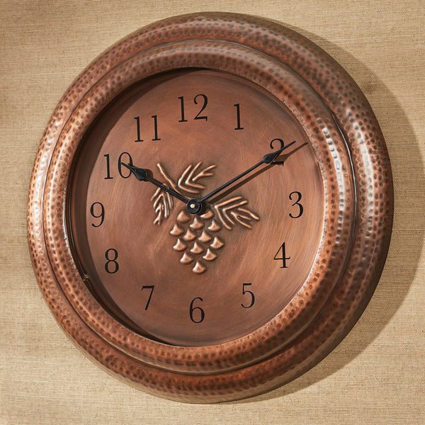 Add a gorgeous accent to any room in your home with the stunning Valley Pine Wall Clock! Featuring warm tones and a charming pinecone design, this clock will bring the outdoors into your home in a stylish way!