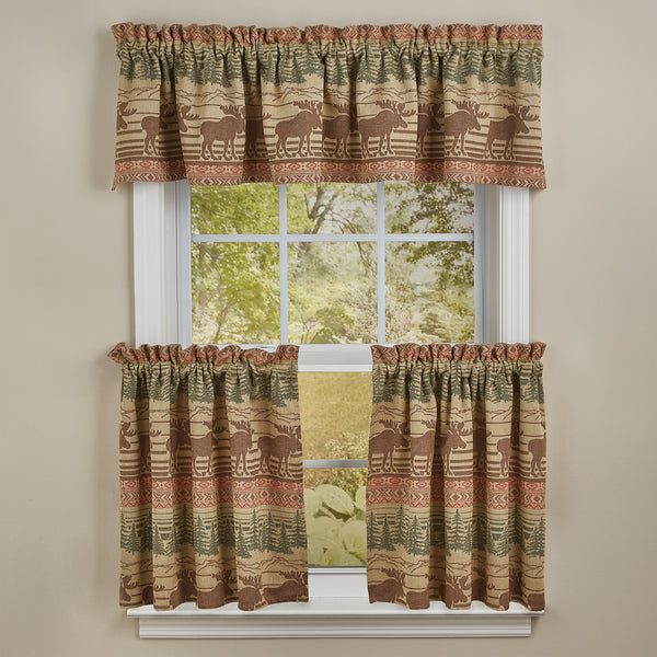 The Moose Jacquard Tiers offer a beautiful outdoorsy appeal! Featuring a blend of neutral colors and a pop of red that work together to create a breathtaking scene of moose in their natural habitat, the design is sure to bring the rugged outdoors in! Coordinate with the complementary Moose Jacquard kitchen linens and curtains to complete the look!