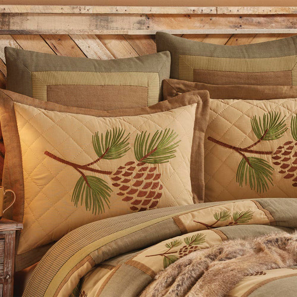 Add a splash of country flair to your quiet place with this Pineview Standard Sham! The pine cone & bough motif take center stage amidst a quilted background, oozing outdoorsy appeal! Rest easy with this country-lovely sham! Complete the look with the Pineview Bed Skirt and Pineview Queen Quilt!