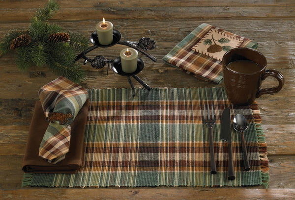 These Wood River Placemats offer a comfy, outdoorsy appeal! Featuring an earthy blend of chocolate, tans & greens that work together to create a simply beautiful plaid pattern, it is further enhanced by charming fringed edges! So versatile, use throughout your home as an accent mat for your favorite candle/decorative pieces, under a lamp, or wherever your creativity leads you!