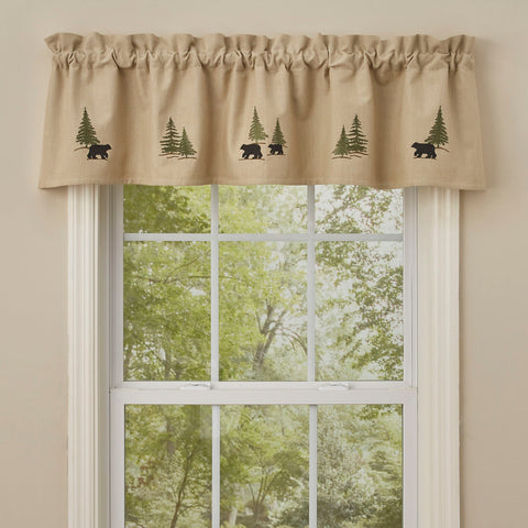 Bring the outdoors inside your home with the Black Bear Embroidered Lined Valance! This tan valance is decorated with embroidered black bears and green pine trees. Coordinate with the Black Bear Embroidered Lamp Shade!