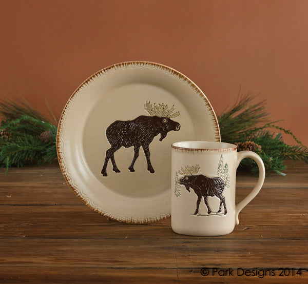 Sip your coffee or hot cocoa in style with the Rustic Retreat Moose Mugs! The charming moose and tree design and rustic edges add country charm to your table! Coordinate with the Rustic Retreat salad plates for a complete look!