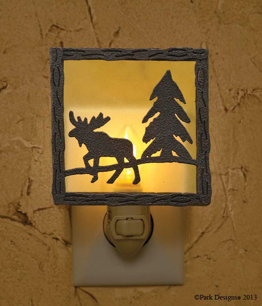 The Moose Night Light  oozes rustic country charm! Reminiscent of the great outdoors, the night light is accented with a moose and pine tree in warm, outdoorsy tones! The wrought iron pieces in the collection offer the same outdoorsy accents that are perfect for your rustic country home!