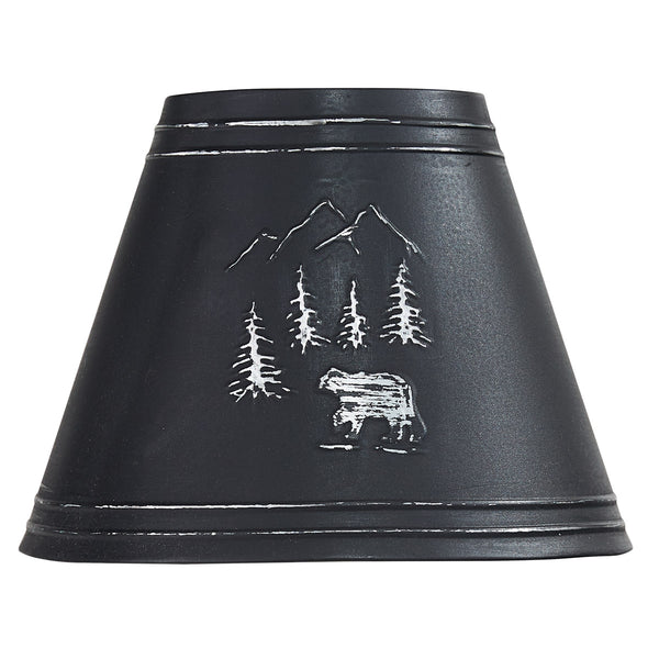 Black Bear Embossed Metal Lampshade features an embossed scene with a black bear strolling through the woods and mountains. The shade is crafted from metal, adding a rustic touch to your outdoorsy decor. Pair with the matching 10" lampshade and 14" lampshade to complete the ensemble! Check out our coordinating Black Bear Utensil Caddy and Black Bear Canisters, also!