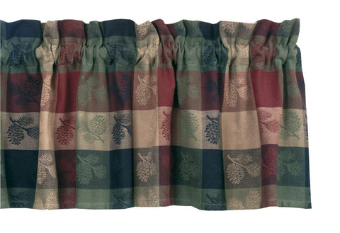 Dress your kitchen windows in rustic yet stylish simplicity with the Pinecone Valance. This plaid curtain features tan, crimson, and green shades that effortlessly remind one of the deep woods and helps create a cozy frame around your window's woodland view. This 14" x 72" kitchen curtain is lined with white cotton to prevent the sun's glare and has a rod pocket for easy hanging. 100% cotton.  DIMENSIONS: 72" x 14"