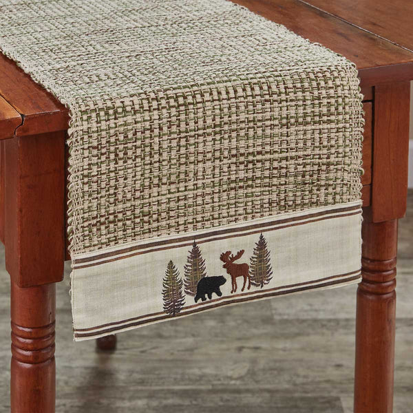 The Wilderness Trail Table Runner brings a charming touch of the wilderness to your table and add a rustic feel! Available in two sizes! Complete the look with the coordinating kitchen linens and tableware!