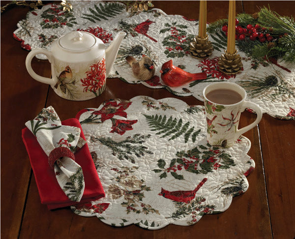 Nature Sings Quilted Round Placemat is beautiful and organic and features the art of Tina Higgins. A customer favorite, this collection has broad appeal and with its cardinal and flower motifs works all winter long.
