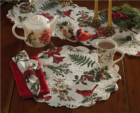 Nature Sings Quilted Round Placemat is beautiful and organic and features the art of Tina Higgins. A customer favorite, this collection has broad appeal and with its cardinal and flower motifs works all winter long.