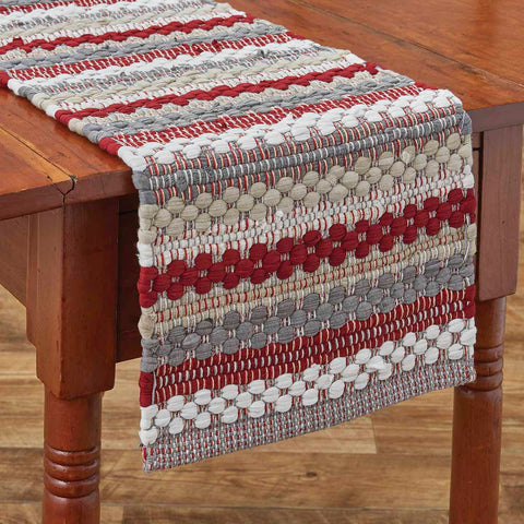 Classic tones of gray, red, and white in a chunky Chindi weave make this 54" table runner a flexible choice for the holidays, but really, the placemats, table runners, and napkins can be used any time of year!