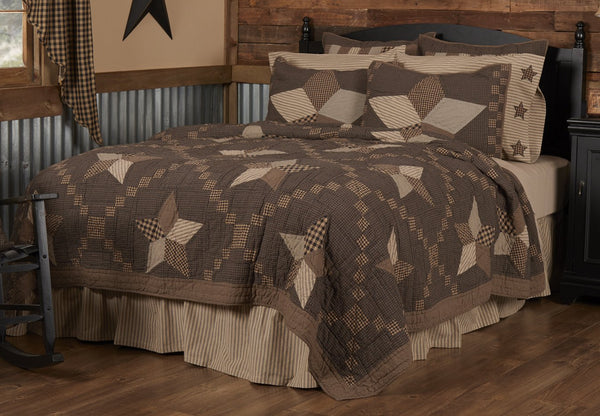 The Farmhouse Star Quilt features large 5 point stars set on a black micro plaid, crisscrossed with a traditional Irish chain in black/khaki check patches. Primitive Country Farmhouse Bedding Home Decor.