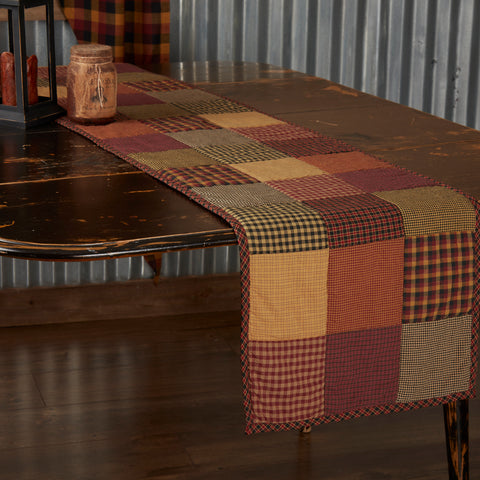 Heritage Farms Quilted Runner 13x72, eaturing red, yellow, and black patchwork. Primitive Country Farmhouse Kitchen Table Dining Home Decor.